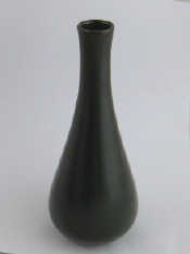 Appraisal: A Chinese ceramic vase in dark olive glaze signed ht