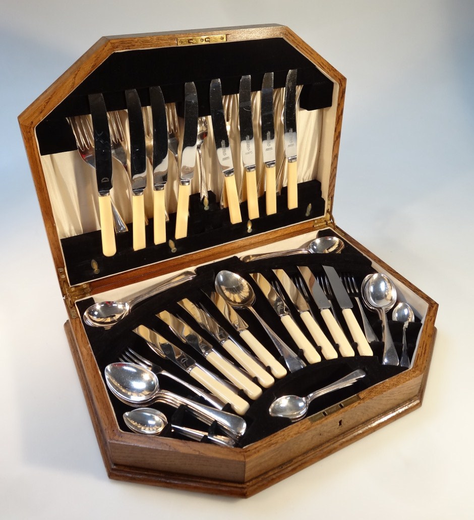 Appraisal: A thC oak cased canteen of silver plated cutlery settings