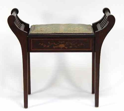 Appraisal: An Edwardian piano stool the hinged seat enclosing a compartment