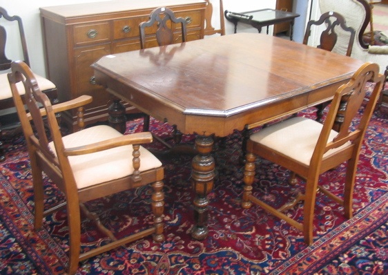 Appraisal: SEVEN-PIECE WALNUT DINING TABLE AND CHAIR SET American c 's