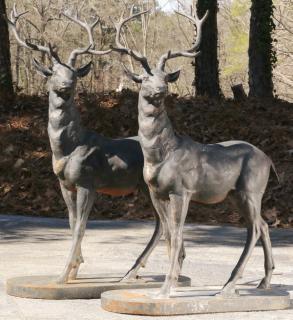 Appraisal: Pair of patinated bronze stags h Pair of patinated bronze