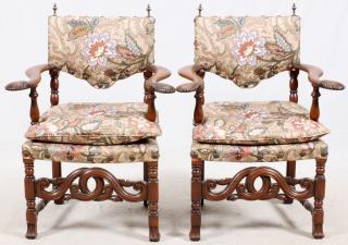 Appraisal: CARVED WALNUT UPHOLSTERED ARM CHAIRS PAIR CARVED WALNUT UPHOLSTERED ARM