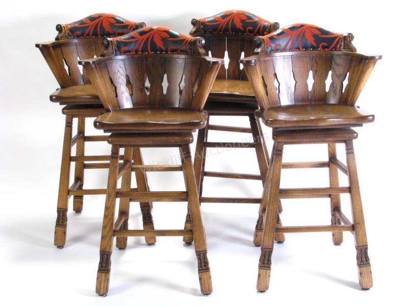 Appraisal: Set of four Romweber Viking Oak swivel bar stools with