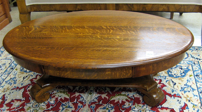 Appraisal: ANTIQUE OAK COFFEE TABLE Empire Revival design American c having