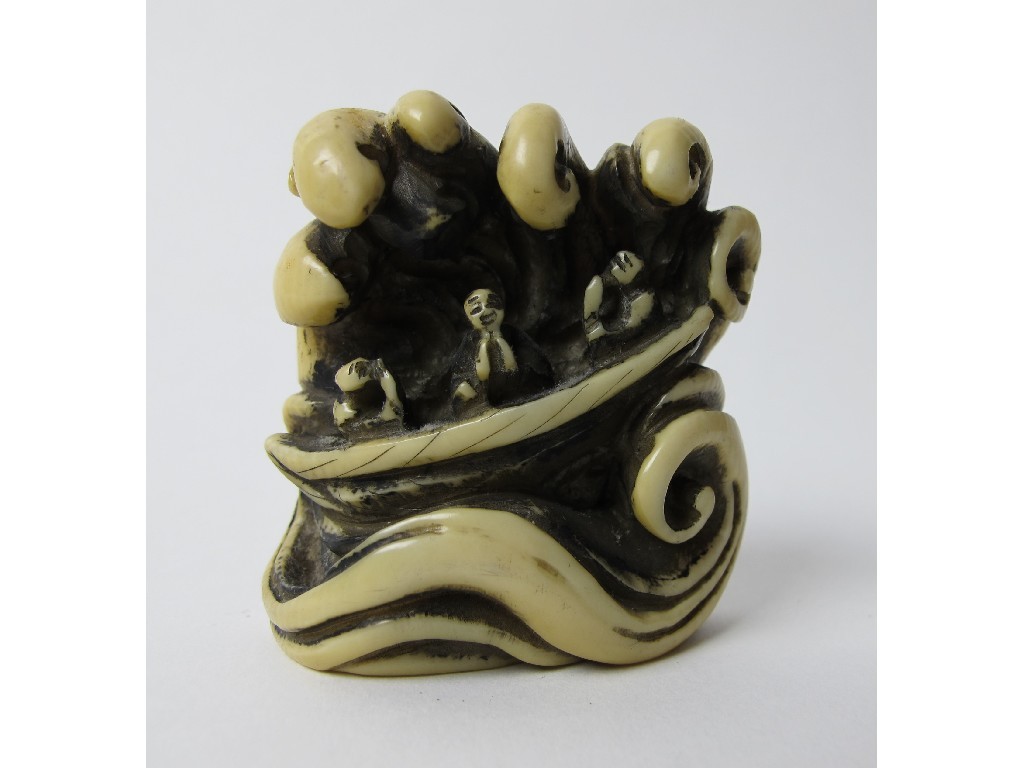 Appraisal: A Japanese carved ivory netsuke of three fishermen in a