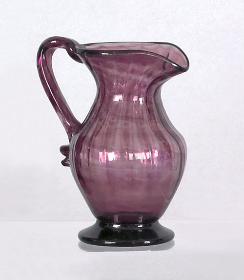 Appraisal: Unusual amethyst blown glass sixteen rib creamer ca with heavy