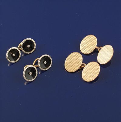 Appraisal: A pair of diamond set circular black onyx gold cufflinks