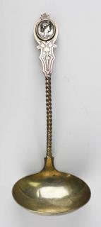 Appraisal: Aesthetic Movement coin silver ladle with twisted handle and medallion