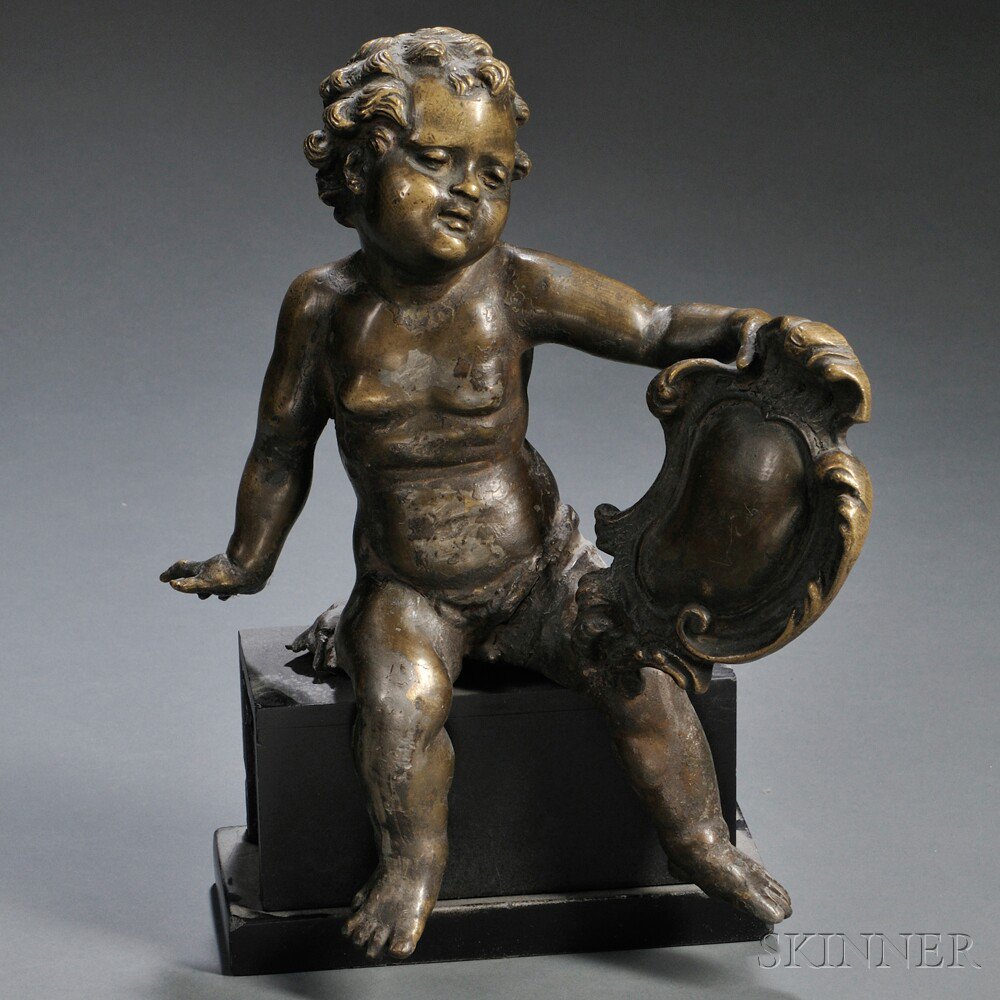 Appraisal: Bronze Figure of a Cherub cast seated and holding a