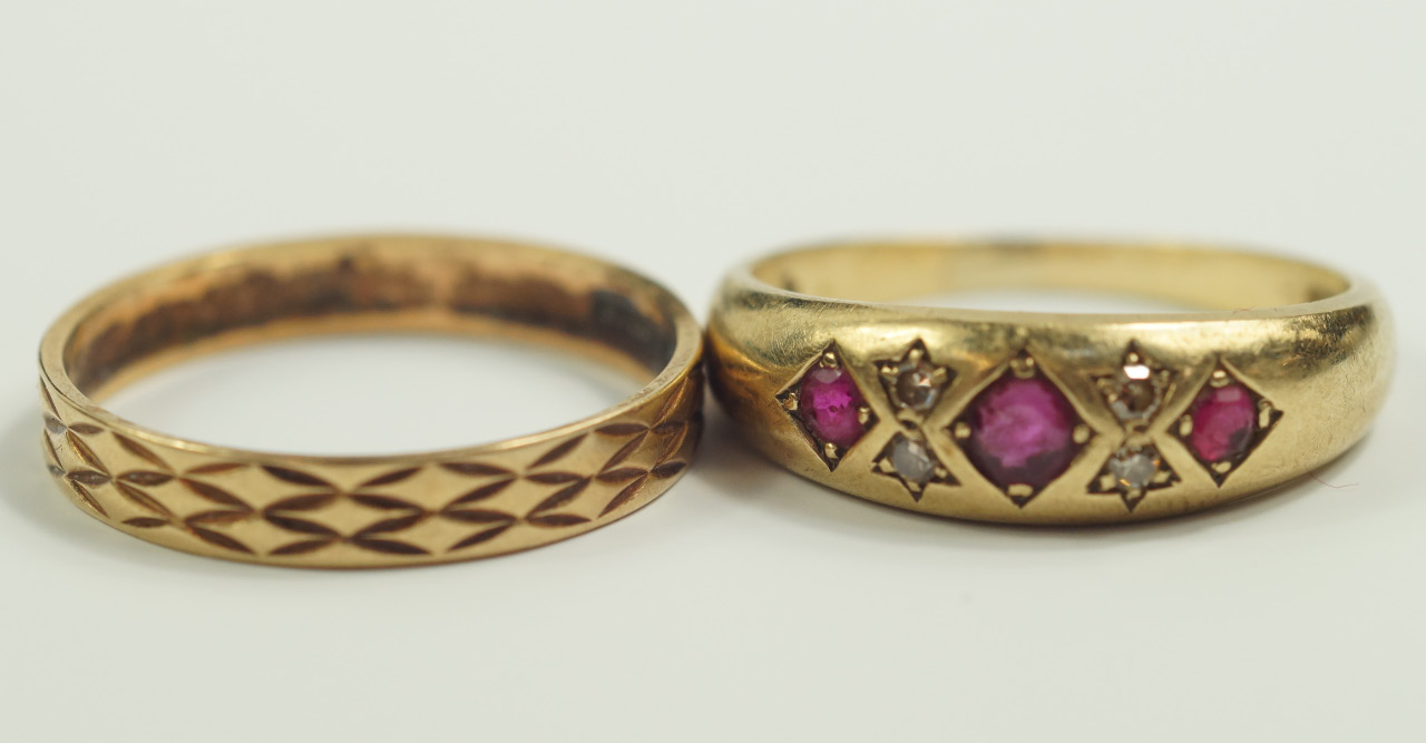 Appraisal: A ct gold and ruby three stone gypsy ring set