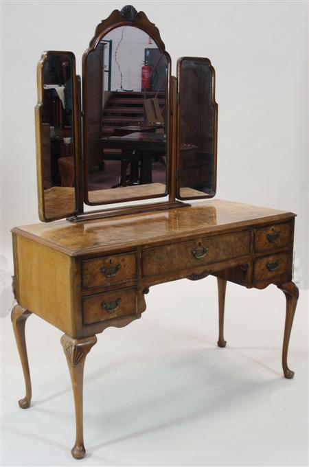 Appraisal: An Edwardian Queen Anne style walnut dressing table the arched