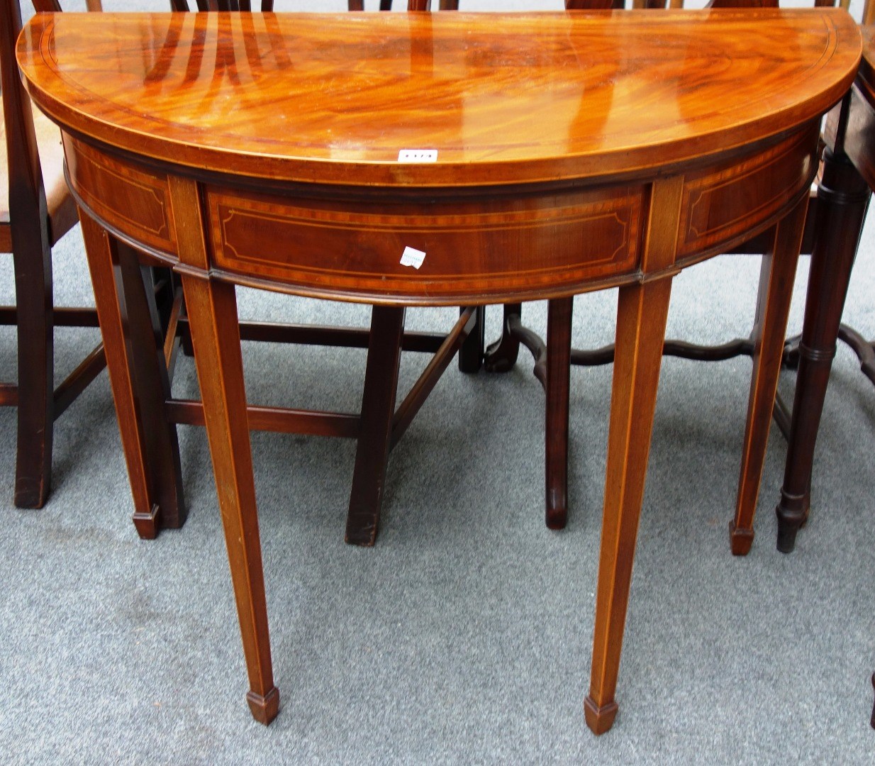 Appraisal: A George III style satinwood banded mahogany card table on