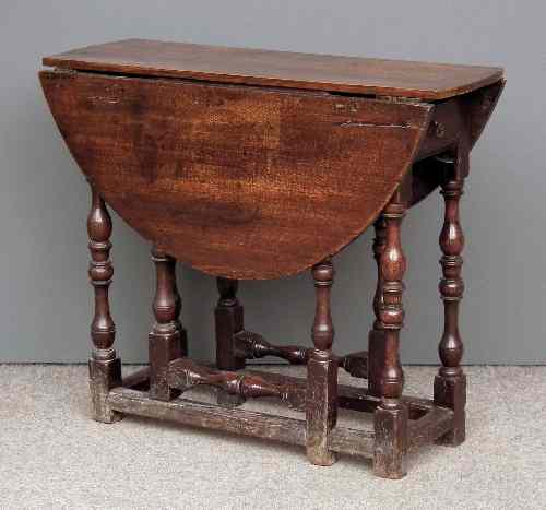 Appraisal: An old oak oval gateleg table of '' th Century''