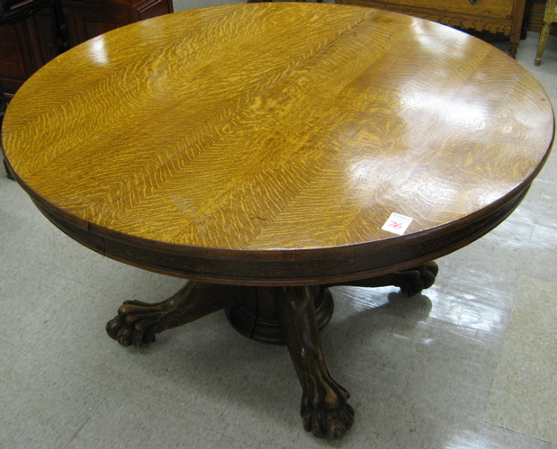 Appraisal: VICTORIAN ROUND OAK DINING TABLE WITH THREE LEAVES American late