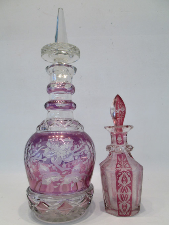 Appraisal: TWO FLASH CUT-TO-CLEAR DECANTERS the larger decanter in a purple