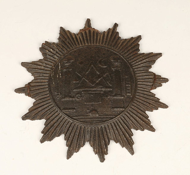 Appraisal: A CAST IRON PLAQUE in the form of a star