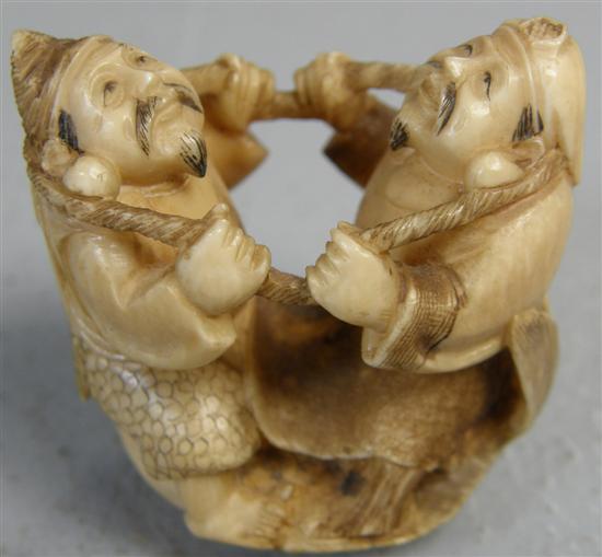 Appraisal: th century Ivory netsuke of two men with a rope