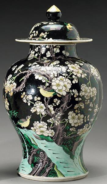 Appraisal: A famille noire enameled porcelain covered jar Its domical cover