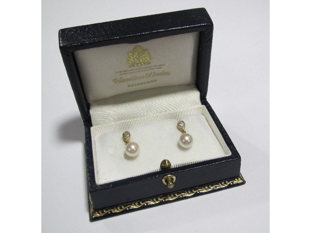 Appraisal: A pair of diamond and cultured pearl drop earrings each