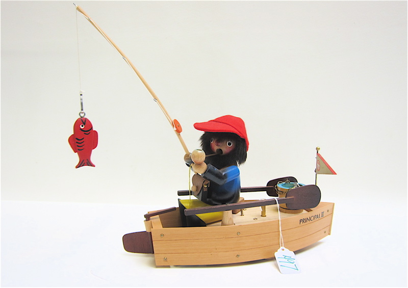 Appraisal: STEINBACH WOOD FIGURAL MUSIC BOX fisherman in boat wind-up music