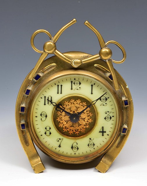 Appraisal: A LATE TH CENTURY BRASS 'HORSESHOE' DESK TOP TIMEPIECE with