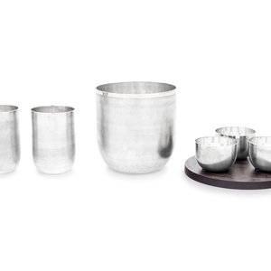 Appraisal: A Puiforcat Jacaranda Silver-Plate Barware Set comprising three small bowls