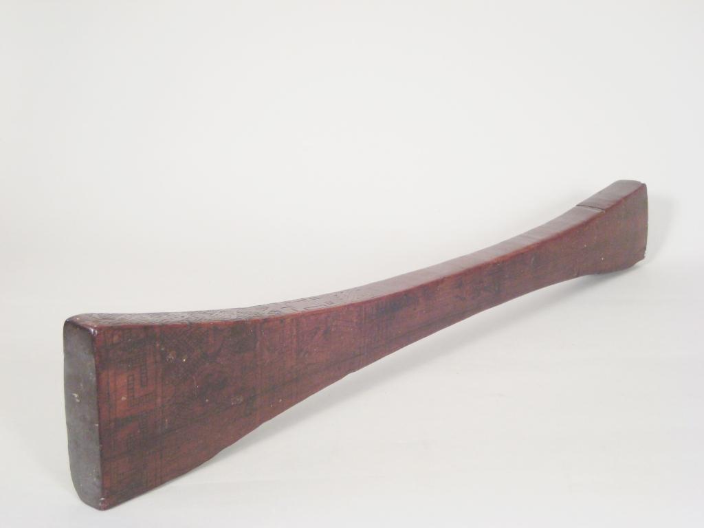 Appraisal: An Ethnic hardwood Club or Paddle finely scratch carved arrow