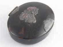 Appraisal: An oval late th century tortoiseshell tobacco box with silver