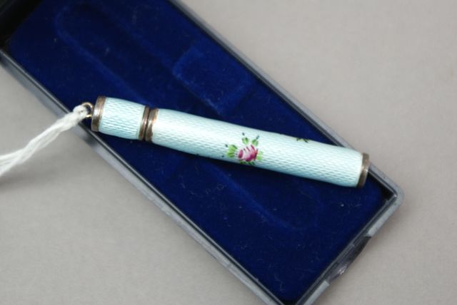 Appraisal: A enamelled silver plated cylindrical lead toothpick holder with screw