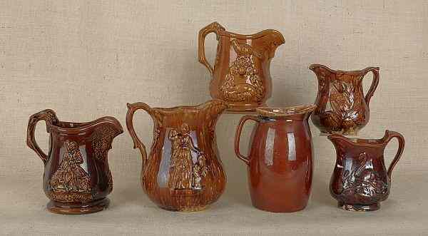 Appraisal: Six Rockingham glaze pitchers th c tallest -