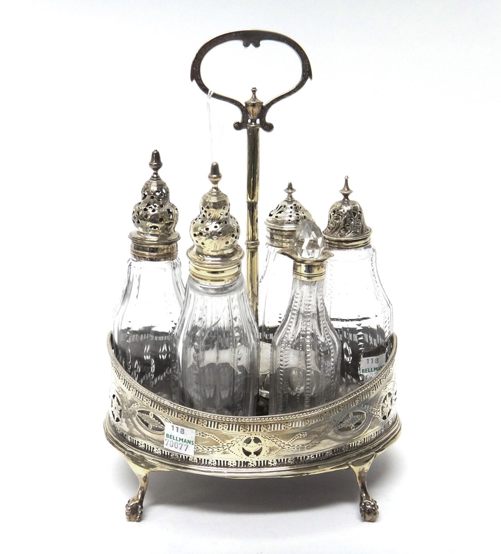 Appraisal: A George III silver cruet stand of oval form with