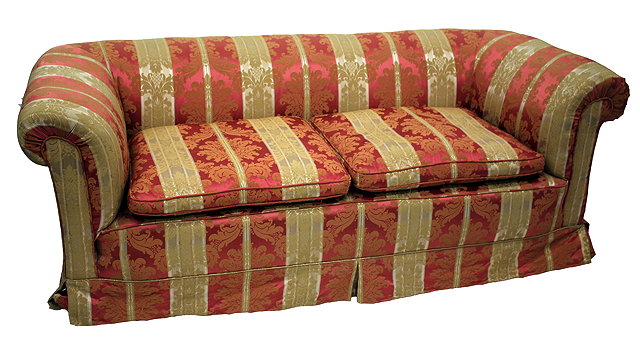 Appraisal: A LATE VICTORIAN EDWARDIAN CHESTERFIELD SOFA with pink and gold