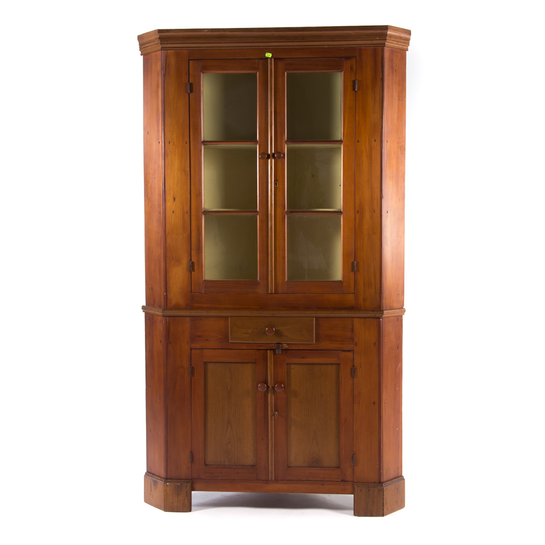 Appraisal: American vermacular cherrywood corner cabinet th century flat molded cornice