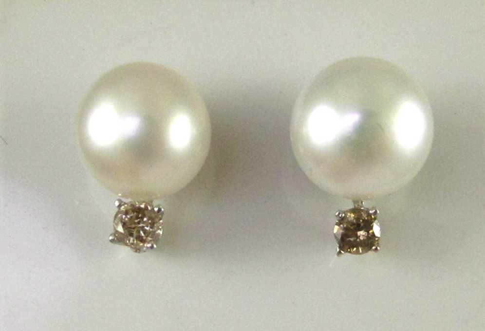 Appraisal: PAIR OF PEARL AND DIAMOND EAR STUDS Each k white