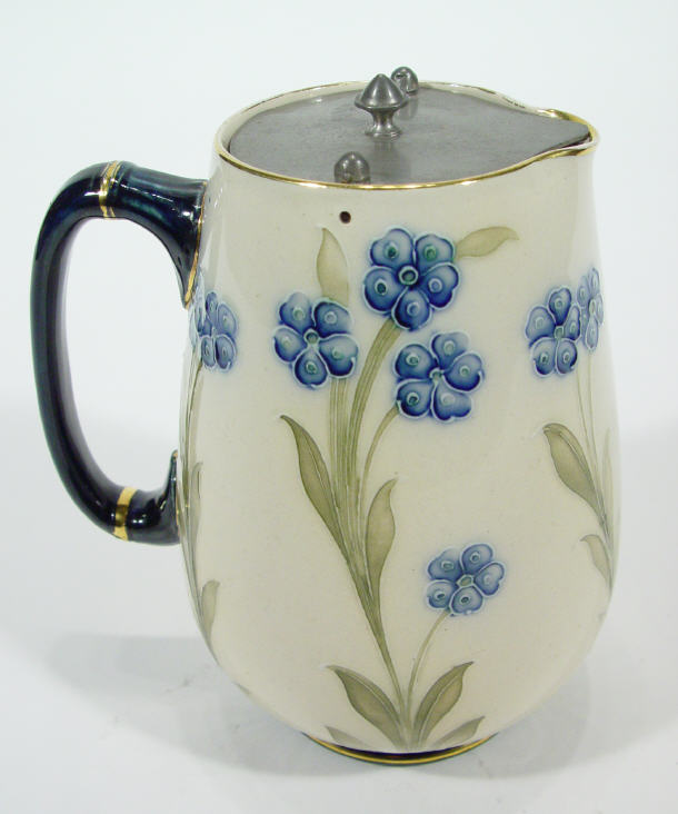 Appraisal: Moorcroft McIntyre hot water pot with pewter lid hand painted