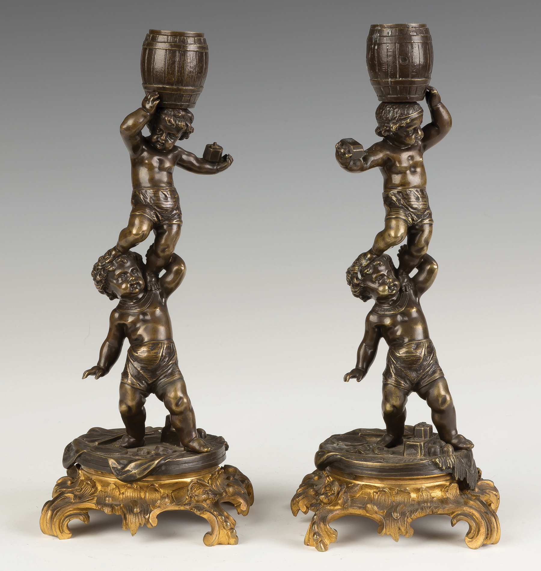 Appraisal: French Bronze and Gilt Bronze Putti Candlesticks th century