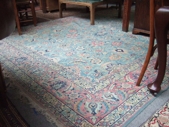 Appraisal: A Tabriz carpet Persian the madder pale indigo field with