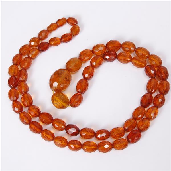 Appraisal: Faceted graduated amber beaded necklace