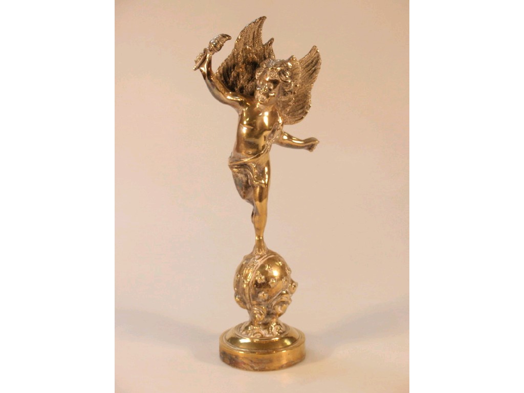 Appraisal: A cast brass figure of a Putto a torch in