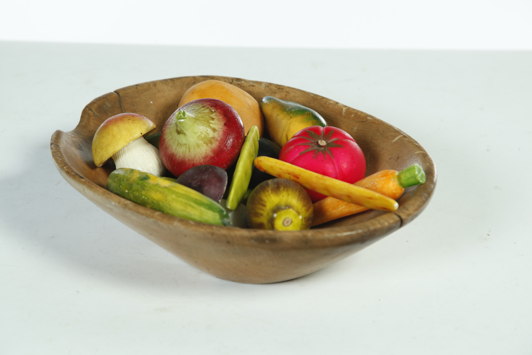 Appraisal: GROUP OF STONE FRUIT IN WOOD BOWL Oval pine bowl