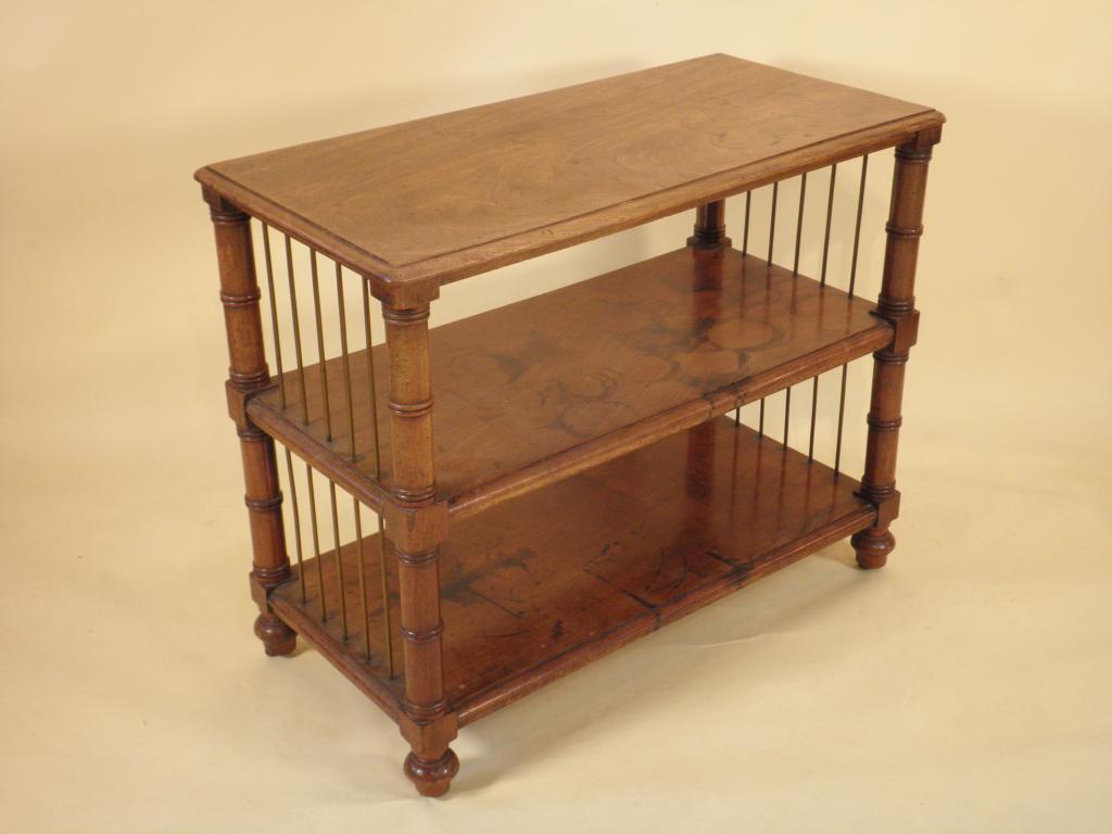 Appraisal: An early Victorian mahogany three tier what-not with a moulded