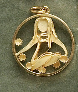 Appraisal: FAIRY CHARM k yellow gold charm in the abstract form