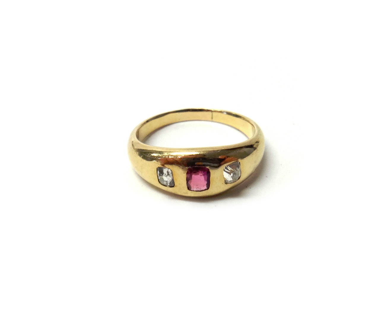 Appraisal: A gold ruby and diamond set three stone ring gypsy