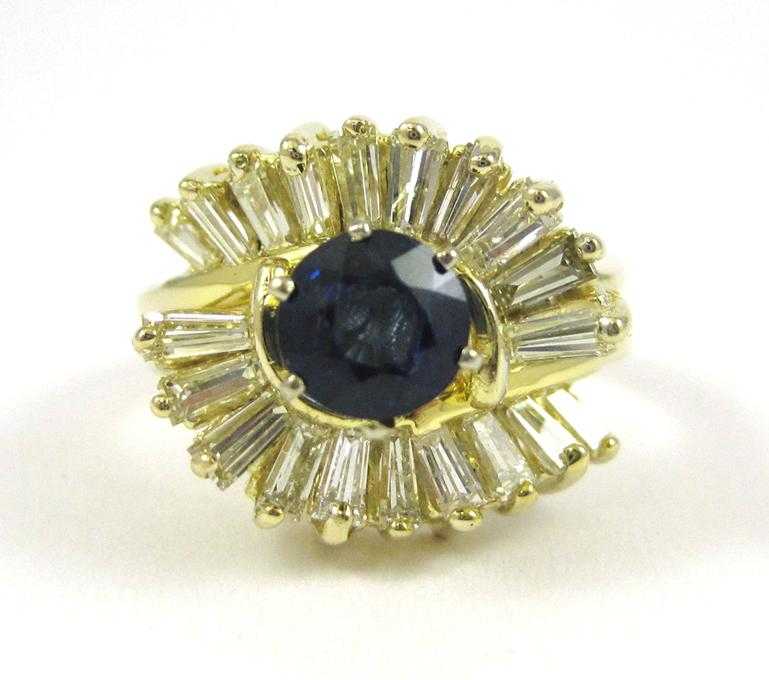 Appraisal: SAPPHIRE DIAMOND AND FOURTEEN KARAT GOLD RING The yellow gold