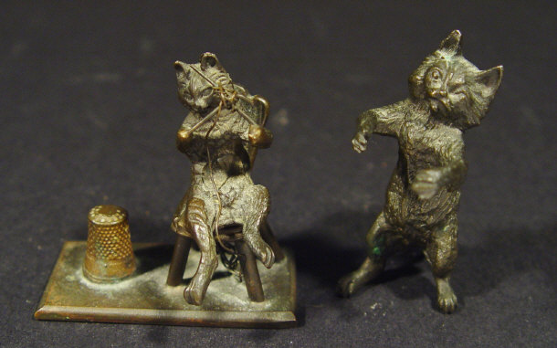 Appraisal: Two miniature Austrian bronze novelty cats one knitting beside a