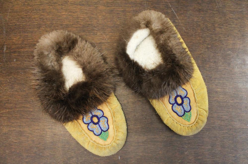 Appraisal: VINTAGE PAIR OF NATIVE AMERICAN MOCCASINS having rabbit fur cuffs