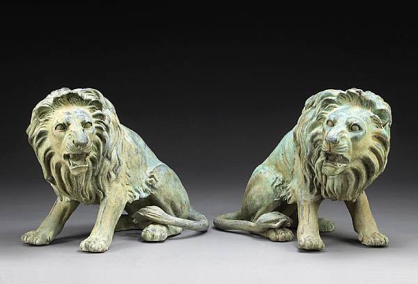 Appraisal: A pair of patinated bronze lion garden ornaments Each seated