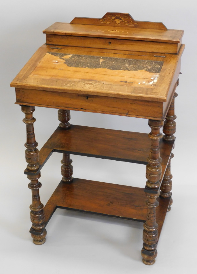 Appraisal: A Victorian walnut davenport the raised back hinged to reveal