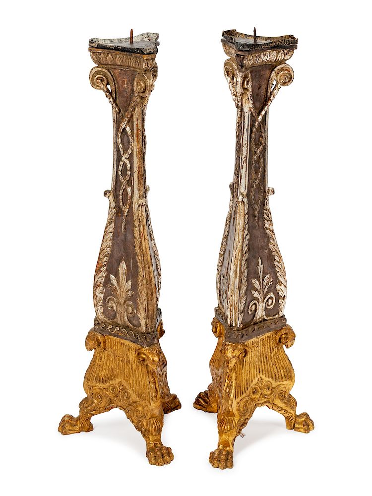 Appraisal: A Pair of Italian Parcel-Gilt and Silvered Wood Candlesticks A