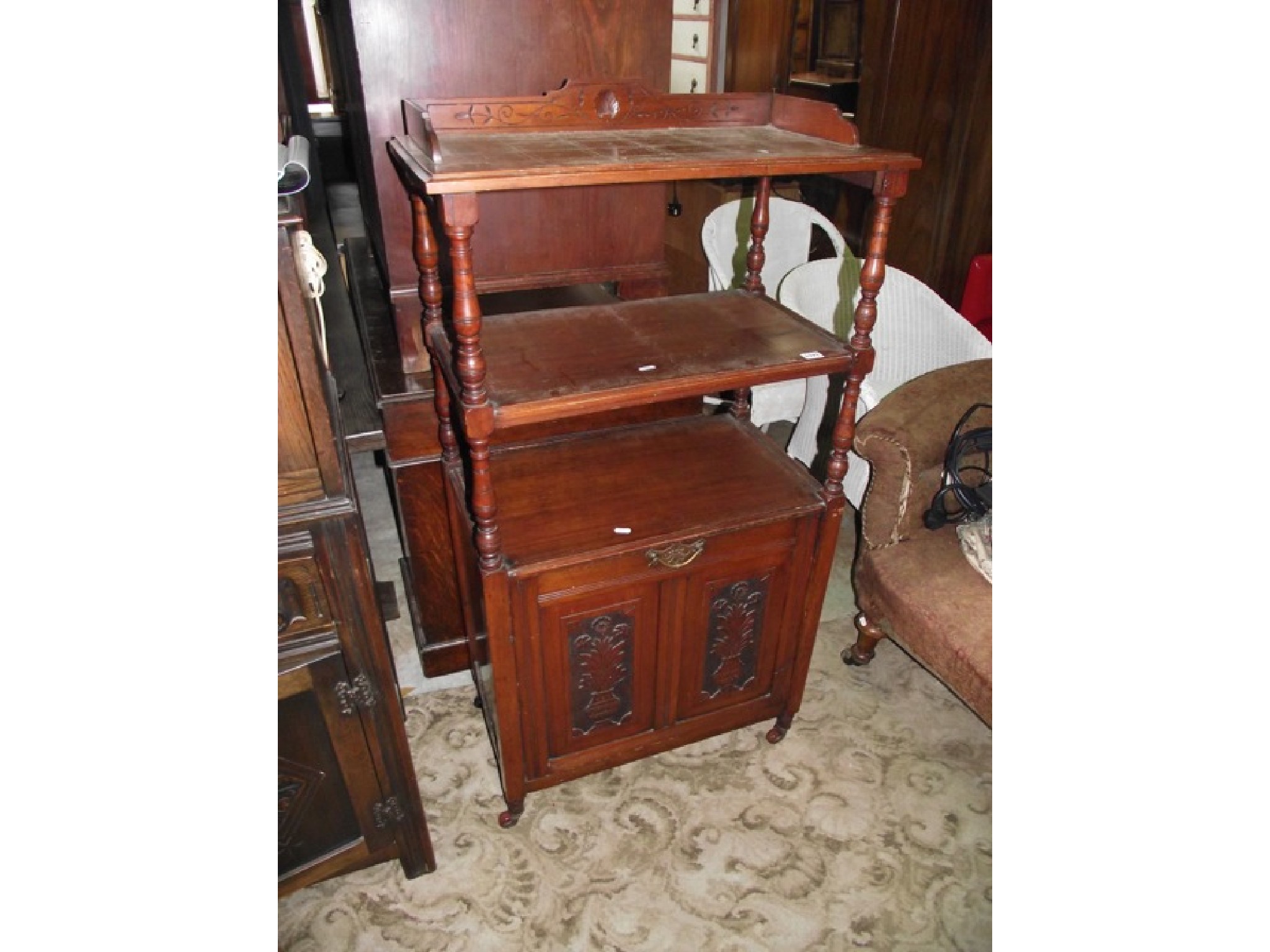 Appraisal: An unusual late Victorian Edwardian walnut whatnot the lower section